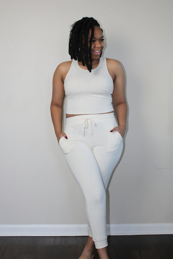 off white French Terry fabric joggers with pockets and drawstring closure and ribbed racerback tank set