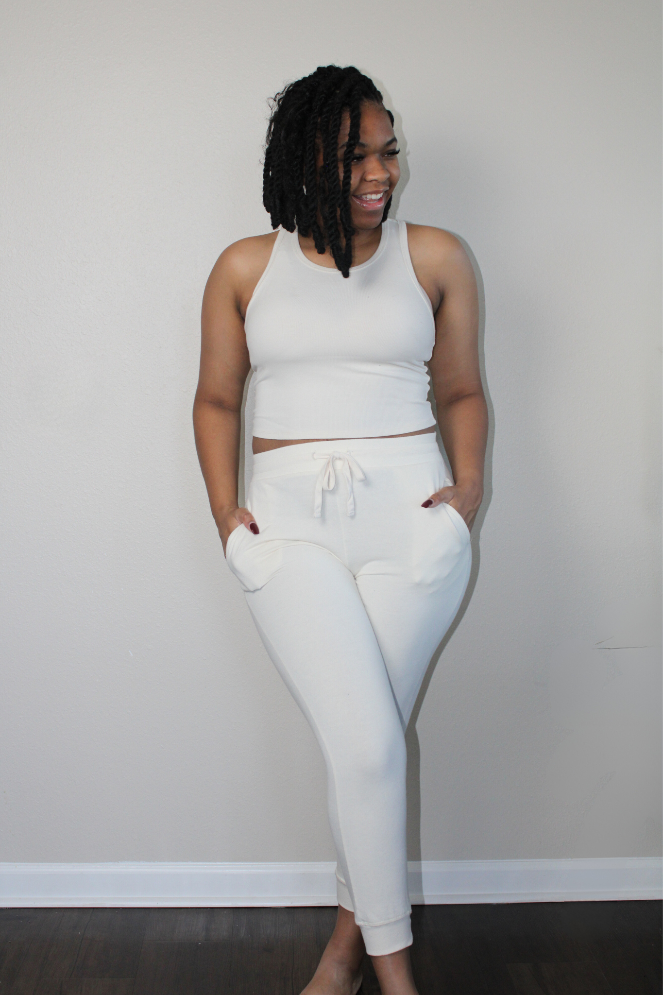 off white French Terry fabric joggers with pockets and drawstring closure and ribbed racerback tank set